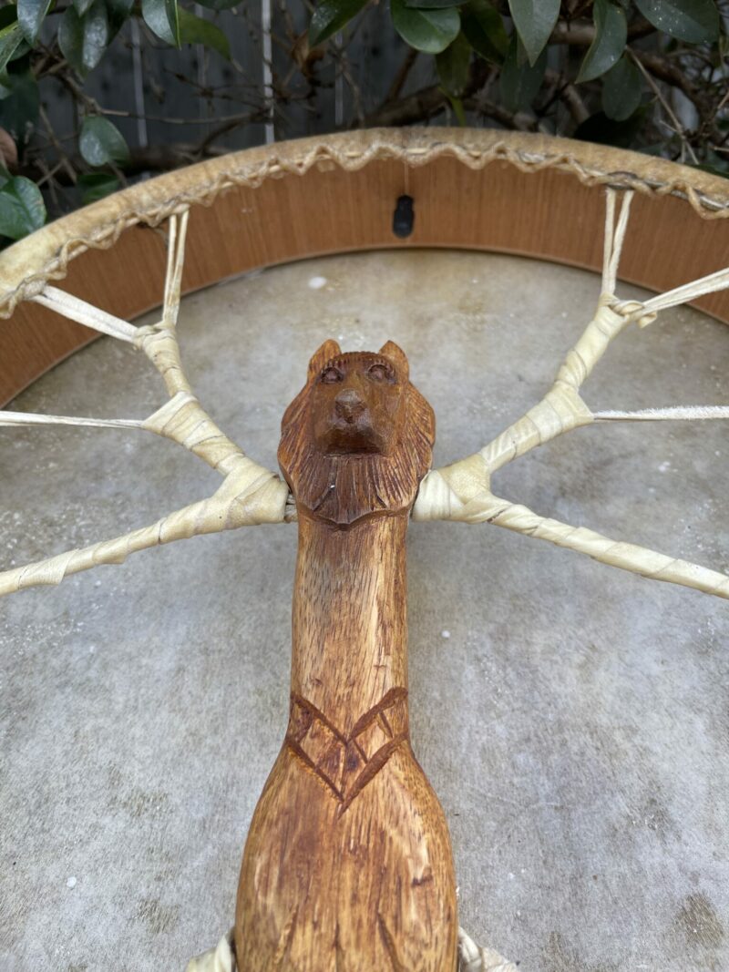 shamanic air pump drum with lion carved handle and goat skin. thecrystalcave.com.au