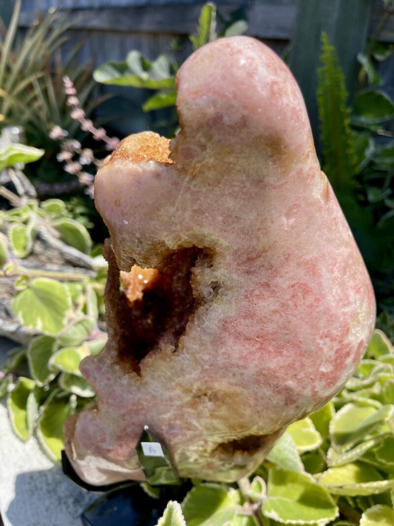 This is a Spectacular Pink Amethyst geode on a stand. thecrystalcave.com.au