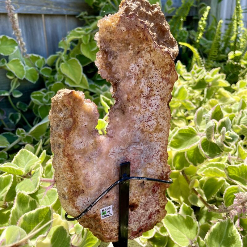 A Pink Amethyst Slab on stand. supporting love and healing negative energies within your nervous system. thecrystalcave.com.au