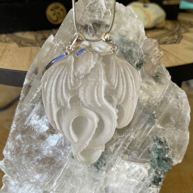 A Selenite Dragon Pendant set in 925 stirling silver. thecrystalcave.com.au