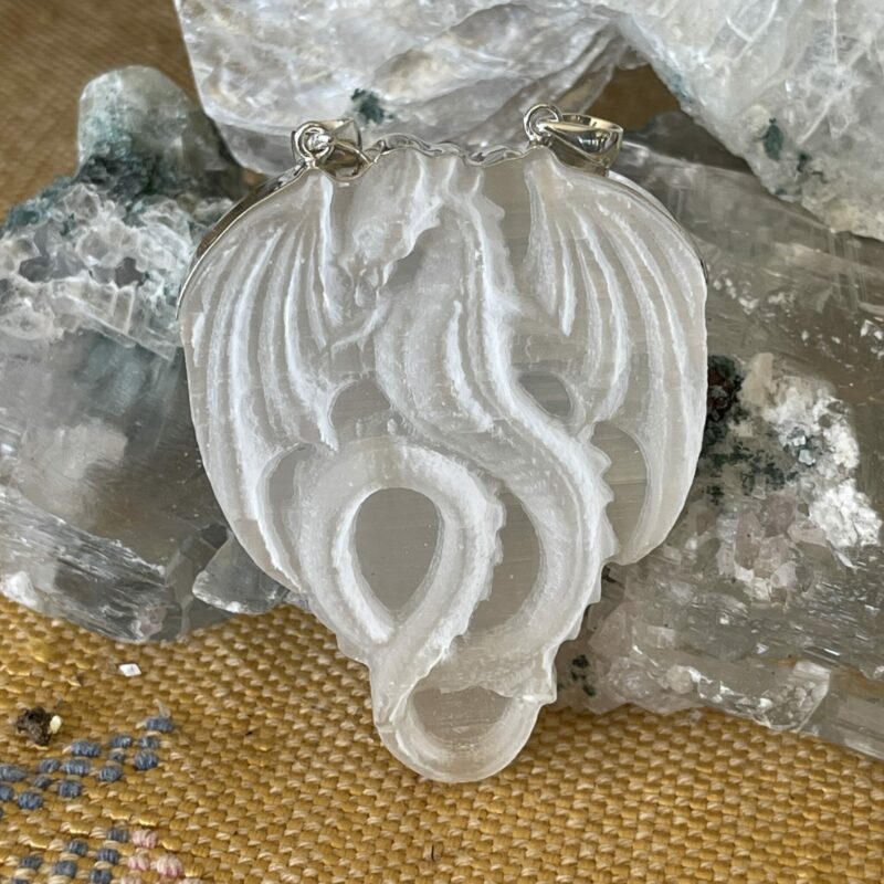 A Selenite Dragon Pendant set in 925 stirling silver. thecrystalcave.com.au
