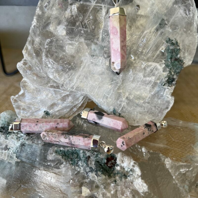 This is a Rhodonite generator pendant set in Stirling silver. Wear it daily, enhancing the balance you wish to fins in your life. thecrystalcave.com.au