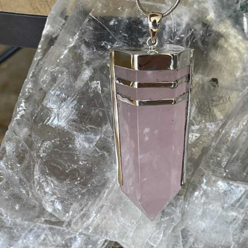 This is a rose quartz generator pendant set in 925 silver. Powerful love. thecrystalcave.com.au