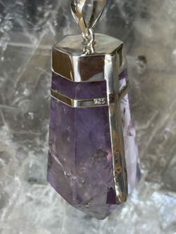 This is an Amethyst pendant. It has deep clear colour and is particularly beautiful. set in stirling silver. It is both protective and connective. thecrystalcave.com.au