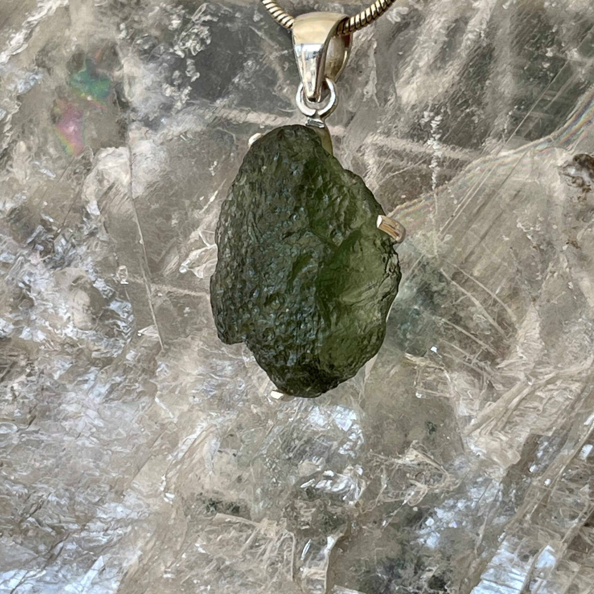 This is a beautiful moldavite 925 sterling silver pendant. Wear it daily. thecrystalcave.com.au