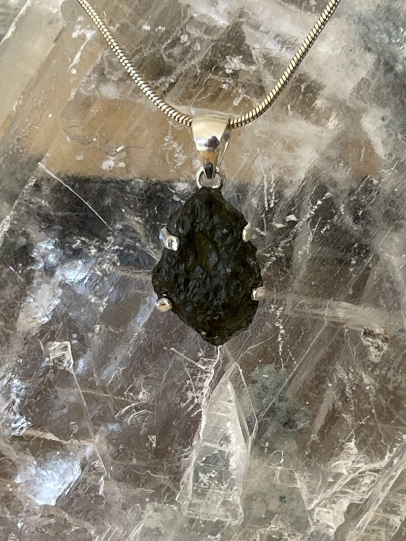 This is a beautiful moldavite 925 sterling silver pendant. Wear it daily. thecrystalcave.com.au