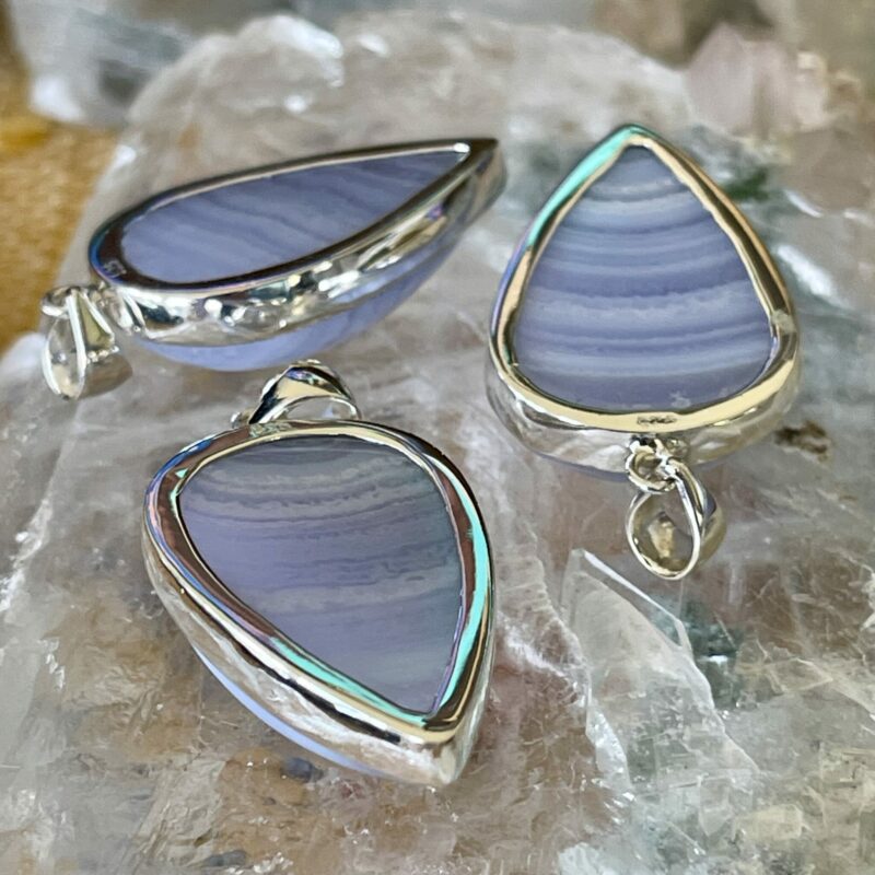 This is a beautiful blue lace agate tear drop cabochon set in 925 silver pendant for peace and communication thecrystalcave.com.au
