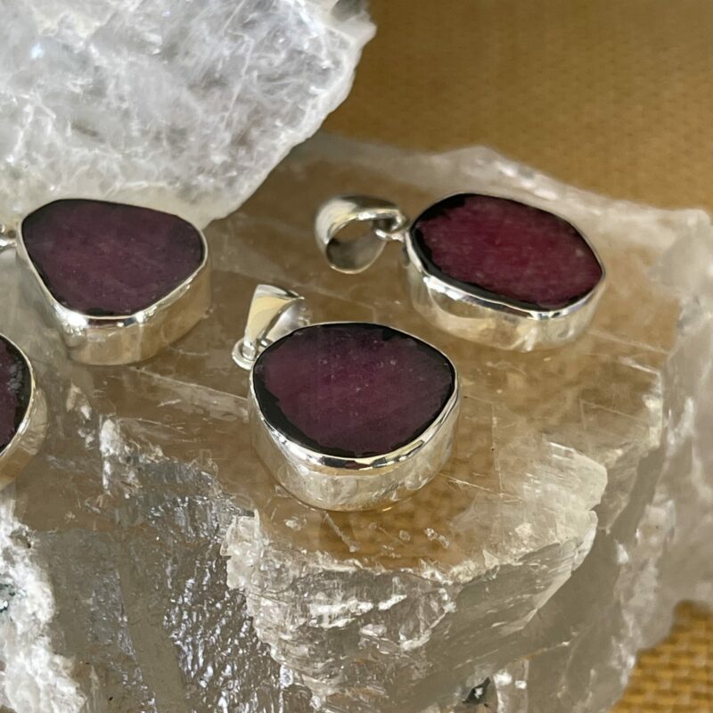 This Ruby Slice set in 925 silver is a beautiful pendant. Courage, love and compassion thecrystalcave.com.au