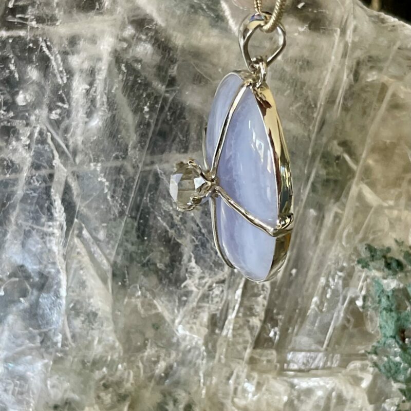 Beautiful calming blue lace agate oval pendant with clear herkimer diamond set in 925 sterling silver thecrystalcave.com.au