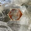 This is a highly polished Hematoid stone. Shaped as a merkabah and set in stirling siler it is truly beautiful. thecrystalcave.com.au