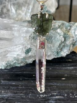 This is a Moldavite and Blade of light pendant set in 925 silver. It is a majestic piece of jewellery. thecrystalcave.com.au