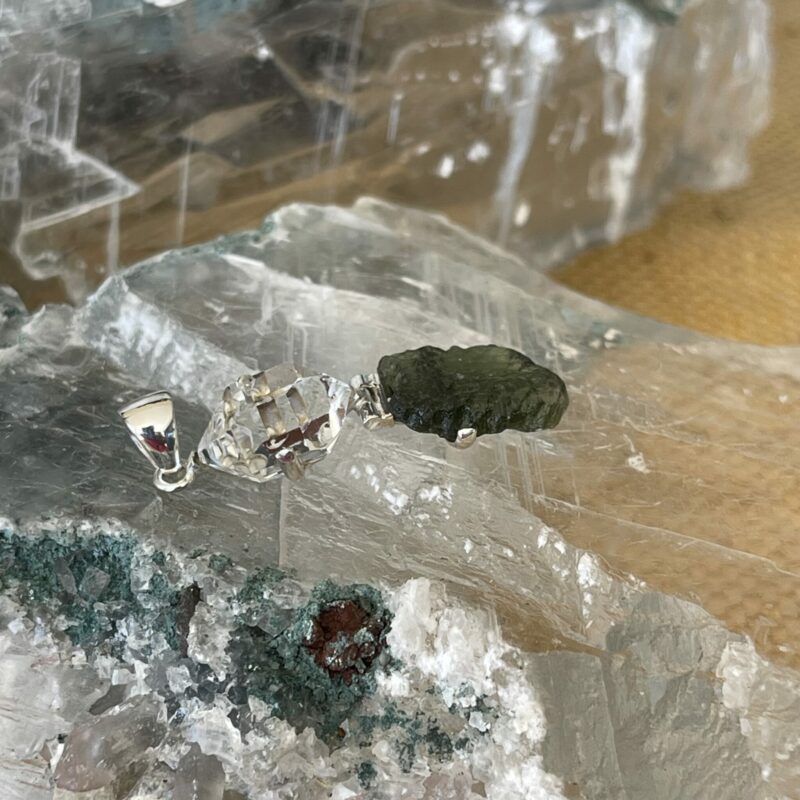 This is a Moldavite and herkimer pendant, set in 925 Stirling silver. thecrystalcave.com.au