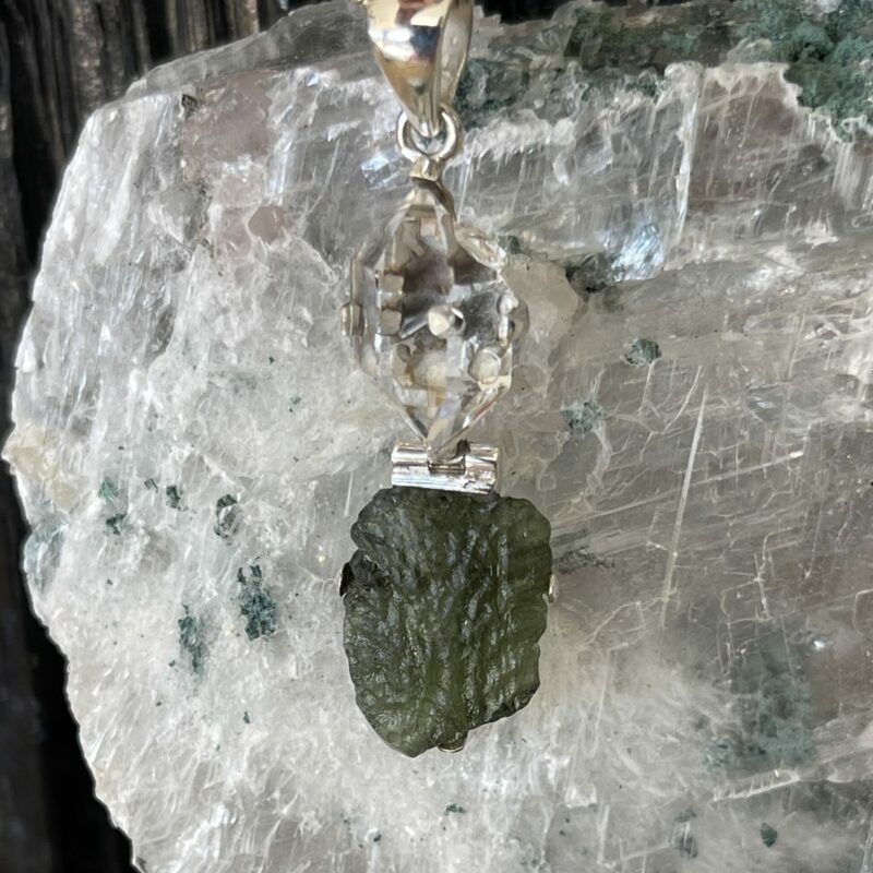 This is a Moldavite and herkimer pendant, set in 925 Stirling silver. thecrystalcave.com.au