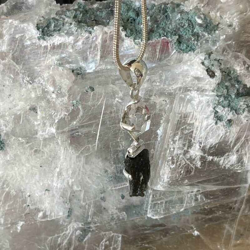 This is a Moldavite and herkimer pendant, set in 925 Stirling silver. thecrystalcave.com.au