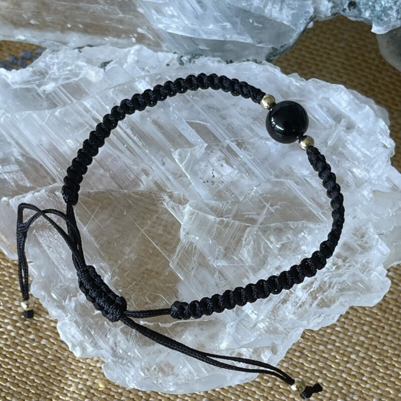 this is black obsidian and cotton hand woven bracelet