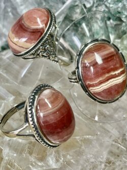 This is a selection of Rhodochrosite rings, oval cut cabochons set in 925 stirling silver. thecrystalcave.com.au