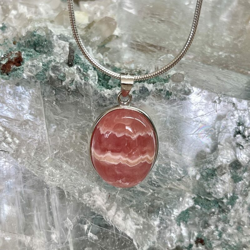 This is a Rhodochrosite oval cut cabochons set in 925 stirling silver. thecrystalcave.com.au