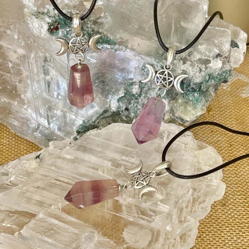 This is a fluorite pendant with triple goddess and pentacle. for connection and protection thecrystalcave.com.au