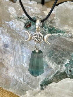 This is a green fluorite pendant with triple goddess and pentacle. for connection and protection thecrystalcave.com.au