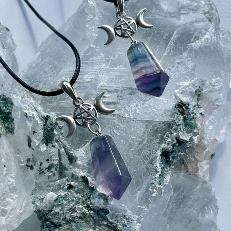 This is a rainbow fluorite pendant with triple goddess and pentacle. for connection and protection thecrystalcave.com.au