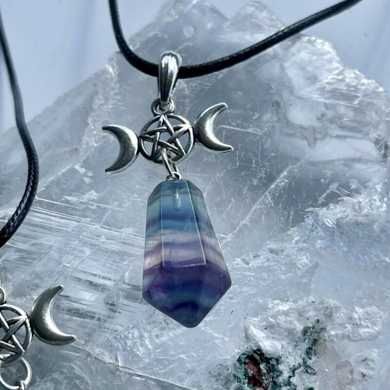 This is a rainbow fluorite pendant with triple goddess and pentacle. for connection and protection thecrystalcave.com.au