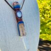 this is beautiful talisman with copper sphere, blue lace agate and clear blade of light crystal point