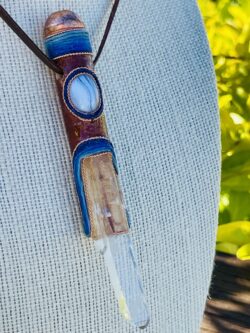 this is beautiful talisman with copper sphere, blue lace agate and clear blade of light crystal point