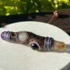 This is Talisman of Protective Guidance with sugilite citrine aquamarine and shungite sphere