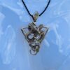 This is Tetrahedron sacred geometry bronze ruby dragon necklace