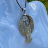 This is tantric start owl wisdom hand carved mother of pearl shell pendant