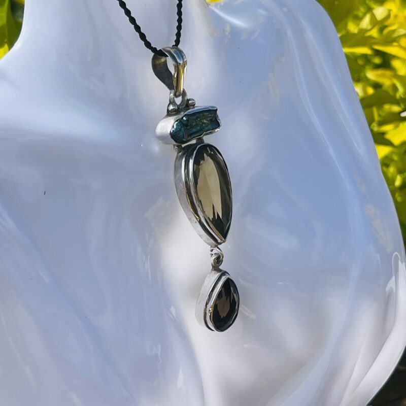 This is mother of pearl, citrine and smokey quartz pendant
