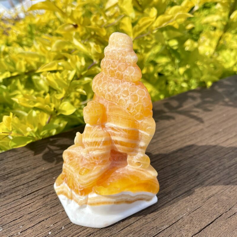 This is Two Sided Orange Calcite Peaceful Buddha