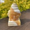 This is Two Sided Orange Calcite Peaceful Buddha