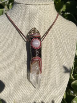 This is Talisman of Clear Growth with kunzite, time link master clear quartz and brass merkabah