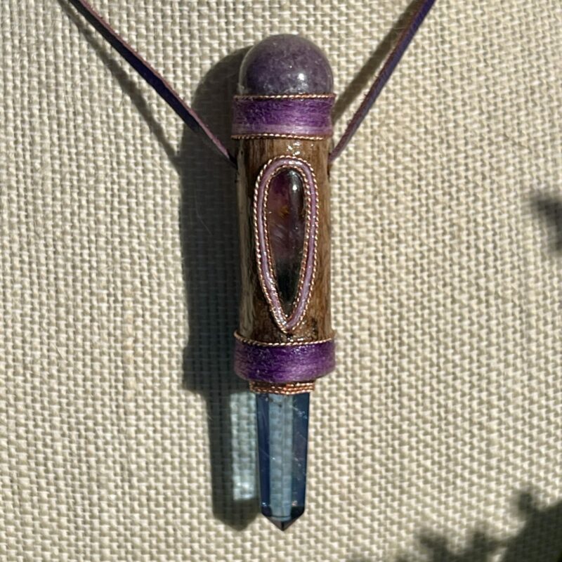 This is talisman of intuitive knowing with super seven tanzine aura and charoite sphere on top