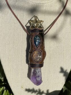 This is Talisman of Confident Deep Heart Connection with amethyst, mexican fire opal, shattuchite, brass merkabah