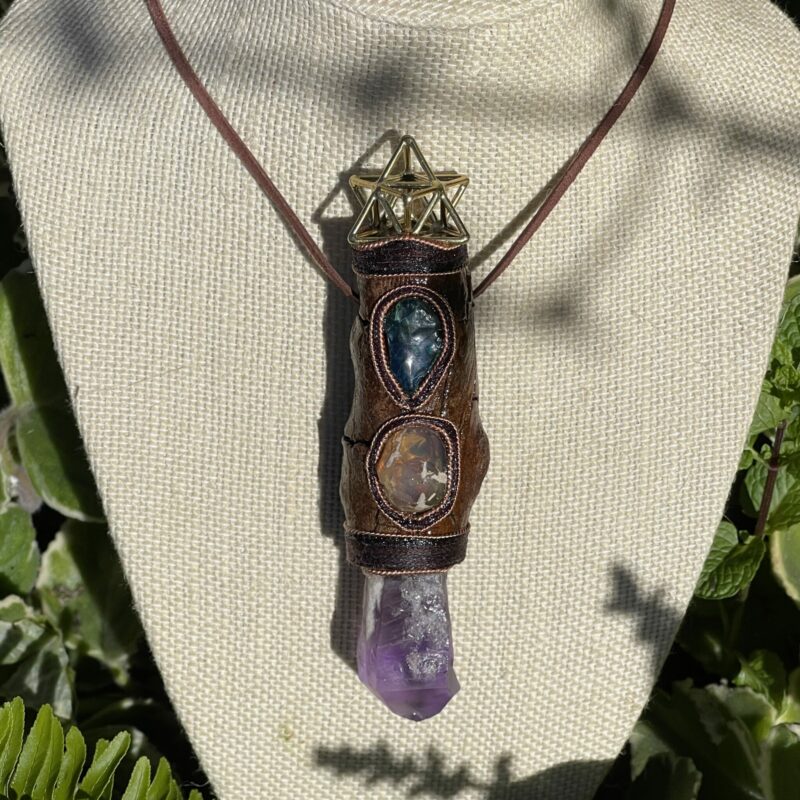 This is Talisman of Confident Deep Heart Connection with amethyst, mexican fire opal, shattuchite, brass merkabah