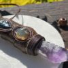 This is Talisman of Confident Deep Heart Connection with amethyst, mexican fire opal, shattuchite, brass merkabah