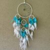 This is a Feather and beads turquoise Dreamcather