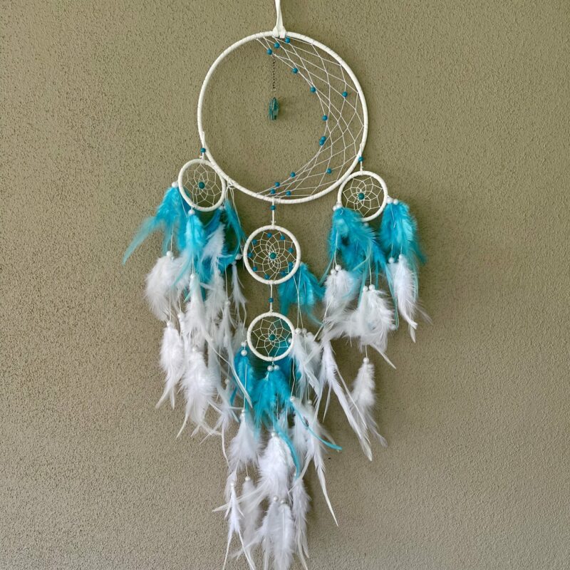 This is a Feather and beads turquoise Dreamcather