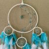 This is a Feather and beads turquoise Dreamcather