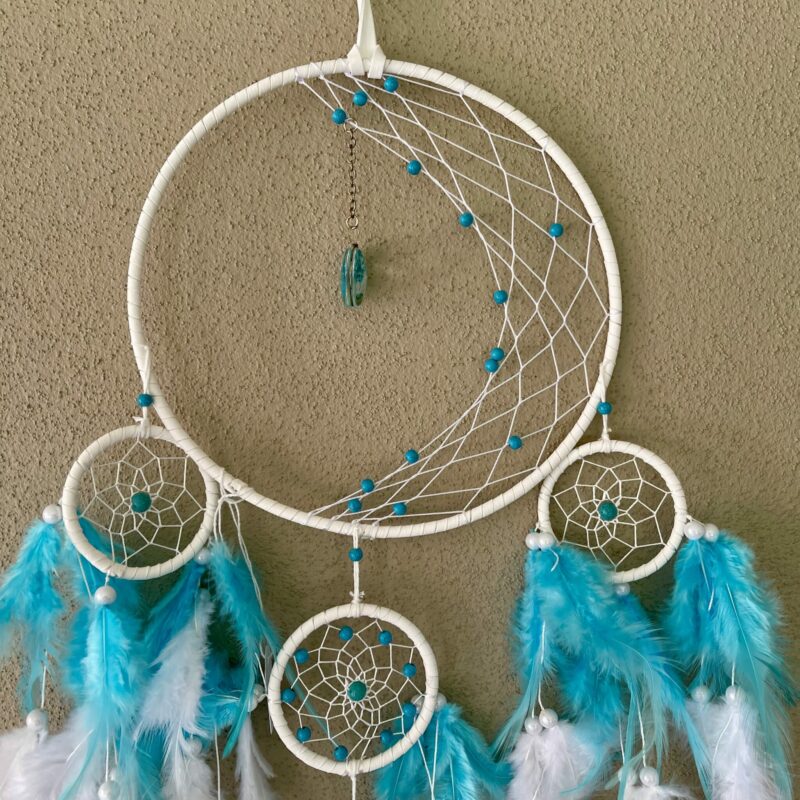 This is a Feather and beads turquoise Dreamcather