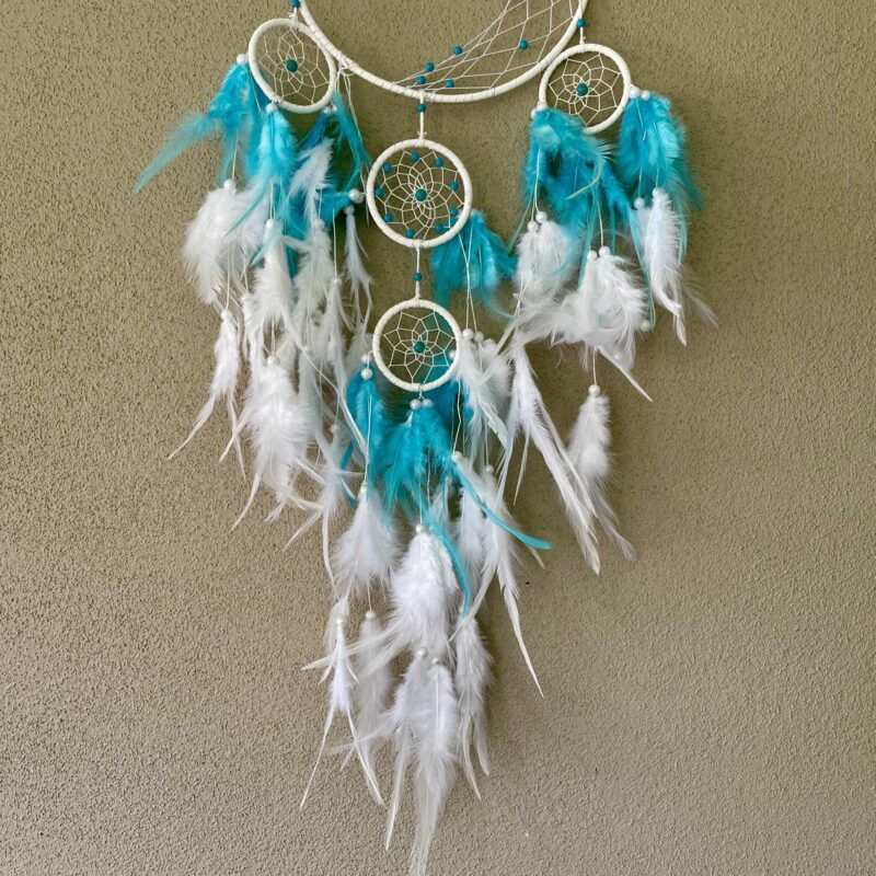 This is a Feather and beads turquoise Dreamcather