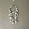 This is gorgeous white with light blue and clear beads dreamcatcher