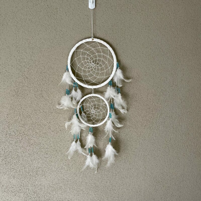 This is gorgeous white with light blue and clear beads dreamcatcher