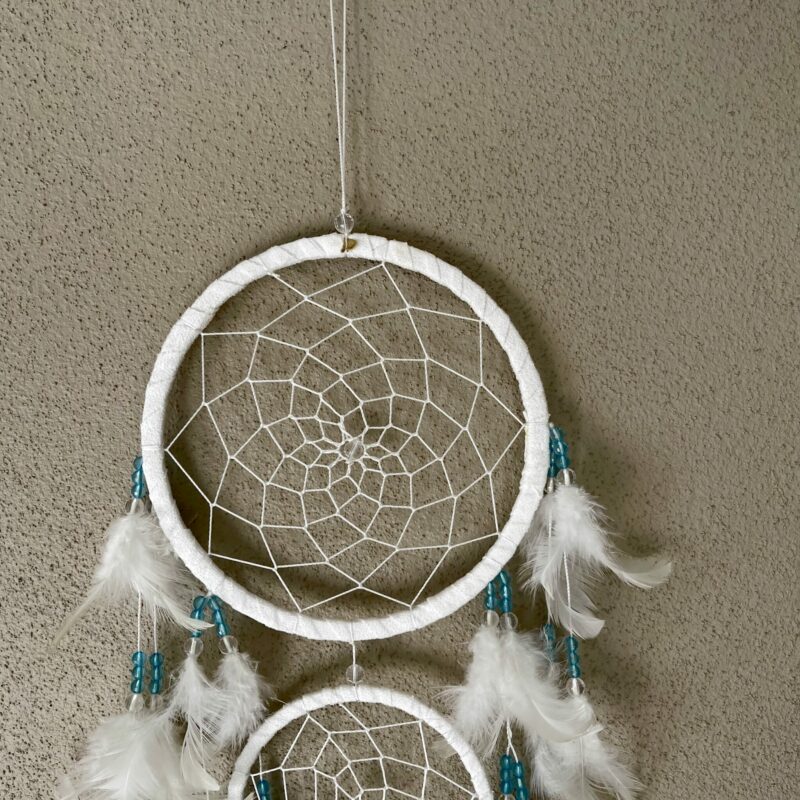 This is gorgeous white with light blue and clear beads dreamcatcher