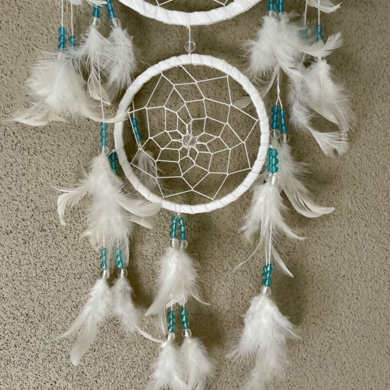 This is gorgeous white with light blue and clear beads dreamcatcher