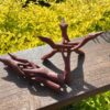 This is Hand Carved Red Wood Tripod Smudging Stand