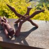 This is Hand Carved Red Wood Tripod Smudging Stand