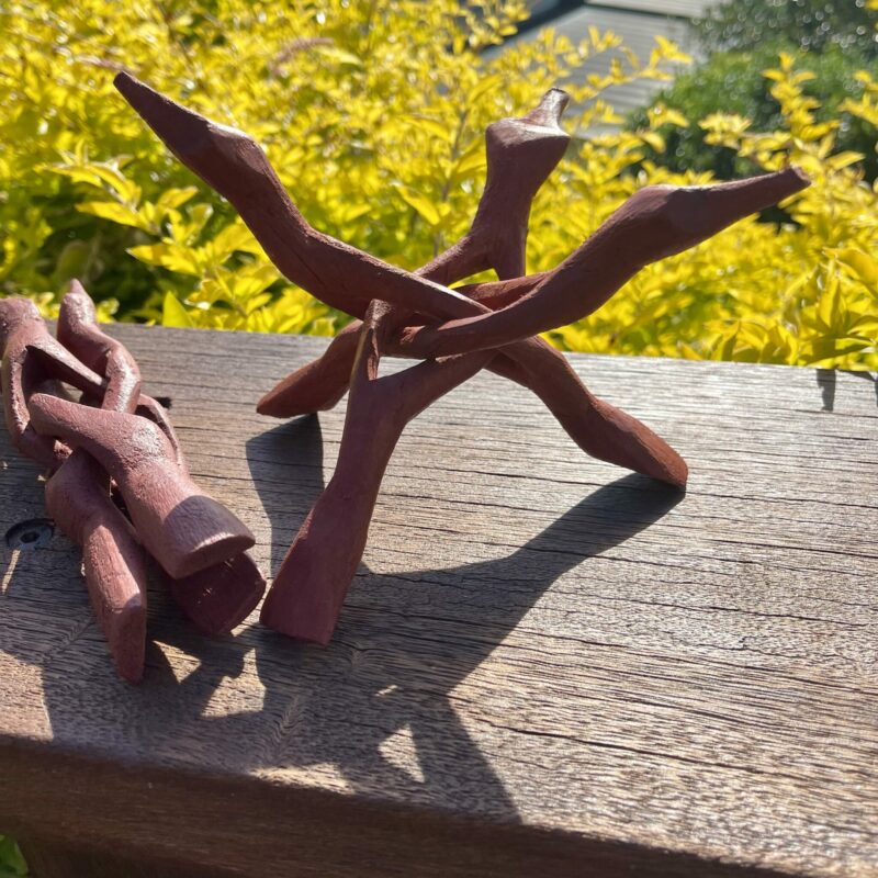 This is Hand Carved Red Wood Tripod Smudging Stand